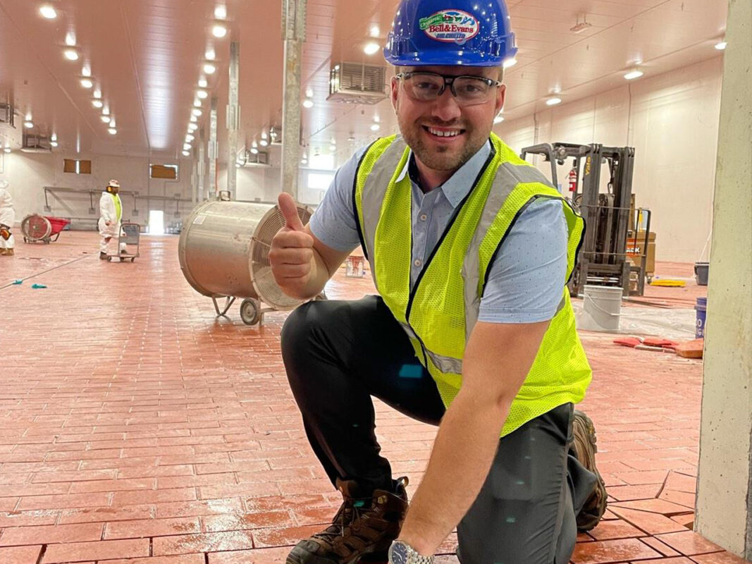 Scott Jr. laying the final Brick at Main Plant