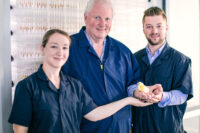 Margo, Scott Sr. and Scott Jr. Sechler at the Hatchery