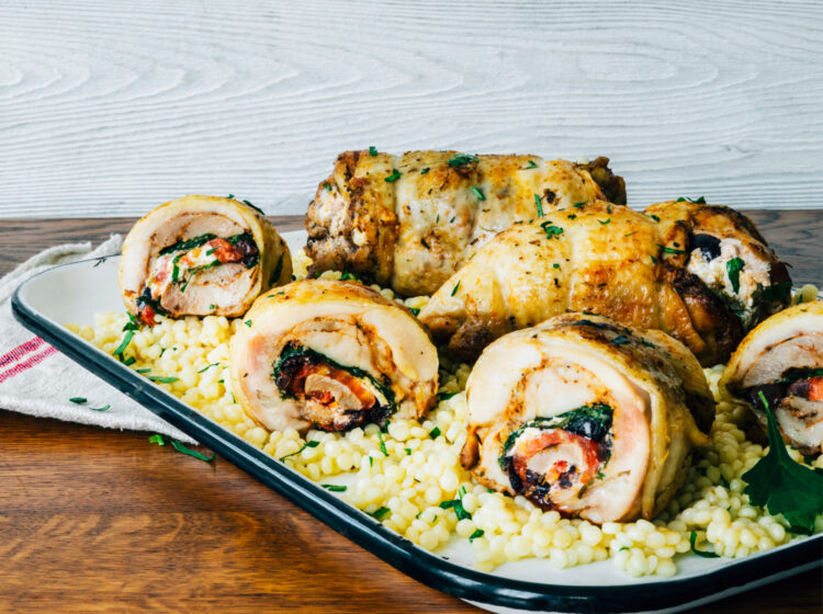 Mediterranean Chicken Legs Stuffed with Tomatoes, spinach, Olives and Goat Cheese