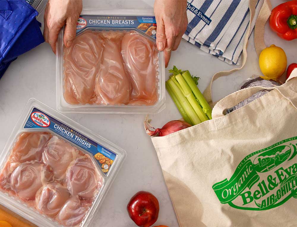 Bell & Evans chicken breasts and thighs on a kitchen counter